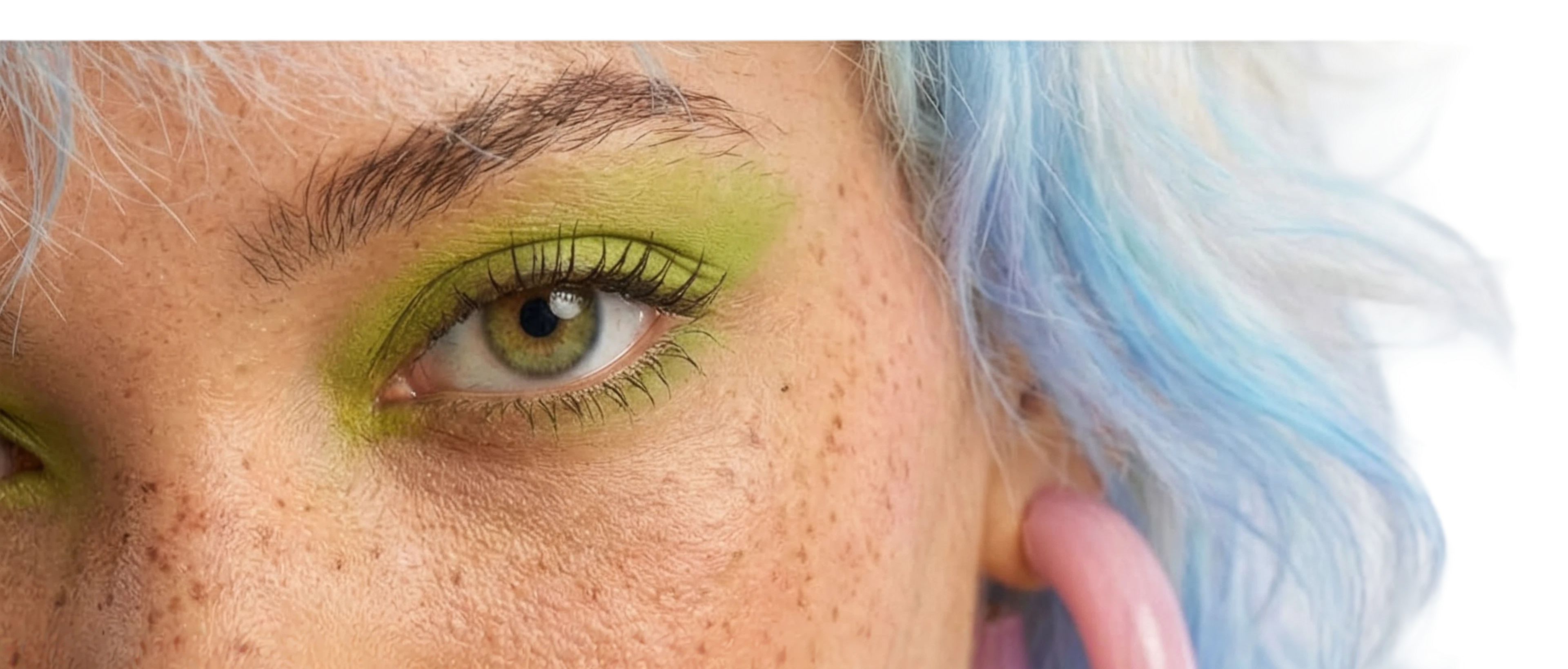 Wildton blue hair color and green eye makeup detail