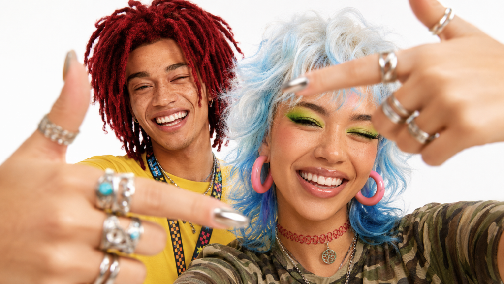 Two friends showing their colorful hair